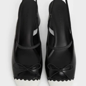 CHARLES & KEITH Black & White Two-Tone Scalloped Cap-Toe Slingback Flats with Bow